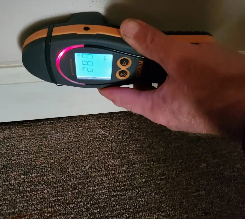 Moisture detection at baseboard during Burst Pipe Cleanup in Cornelia